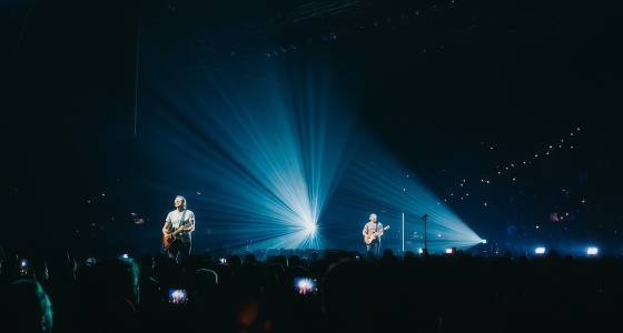 Coldplay performing live on stage at Wembley Stadium in London
