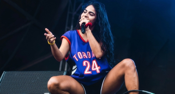 Jessie Reyez performing live on stage at The Roundhouse in London