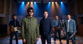 Oasis performing live on stage at Murrayfield Stadium in Edinburgh