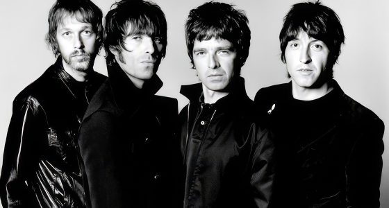 Oasis performing live on stage at Wembley Stadium in London