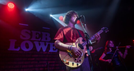 Seb Lowe performing live on stage at SWG3 in Glasgow